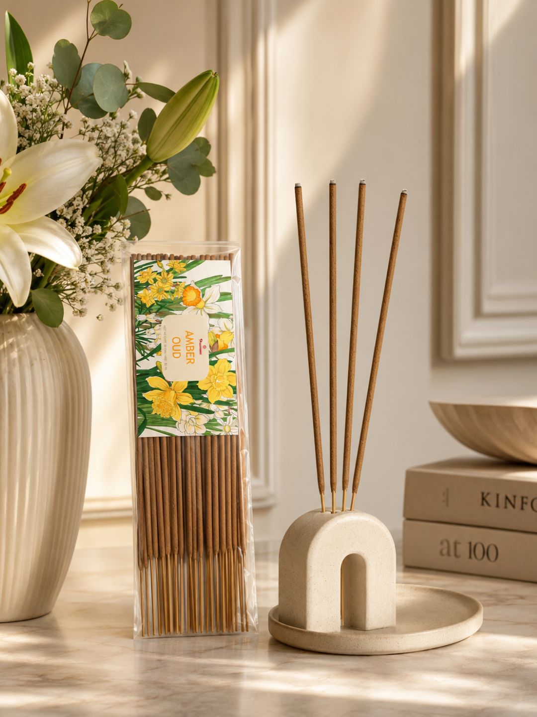 Amber oud agarbatti incense sticks in stand with wrapped pack