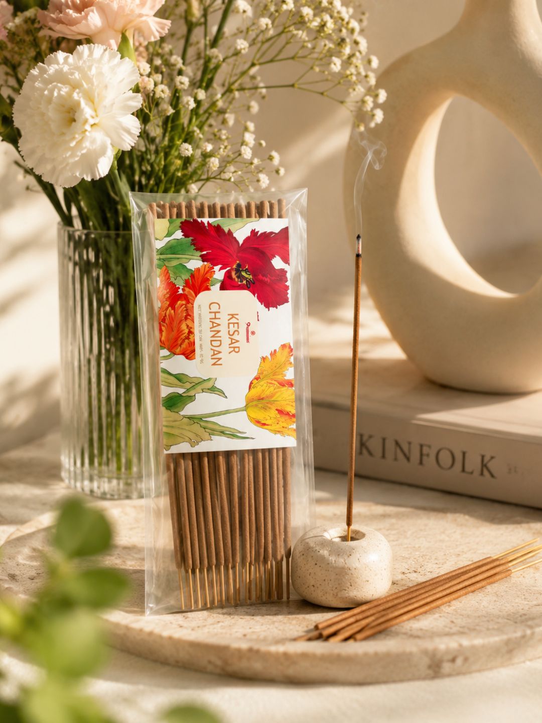 Premsons incense sticks pack in clear wrap with floral artwork, shown with several sticks