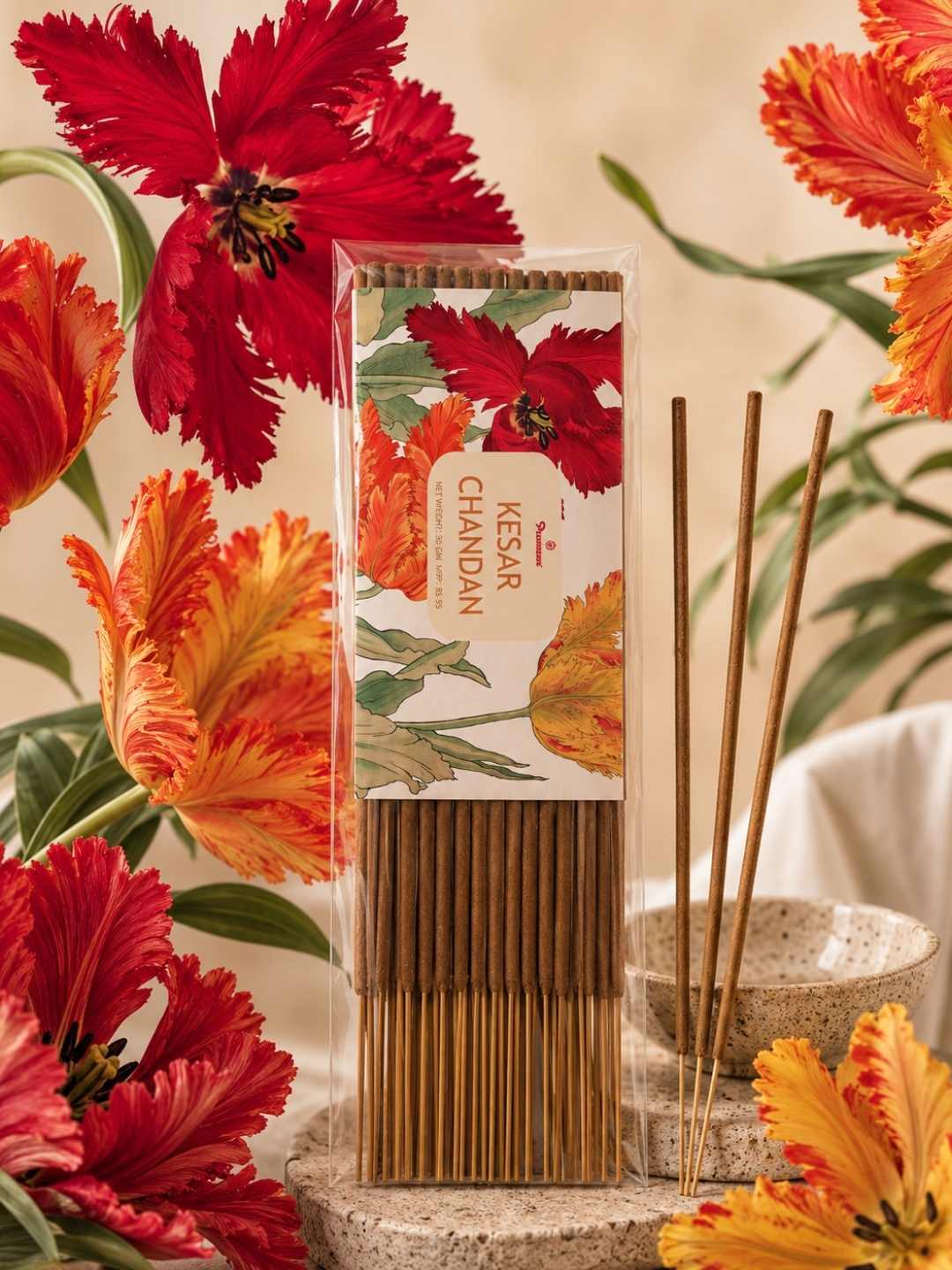 Boxed agarbatti incense sticks set with floral design; light brown incense sticks