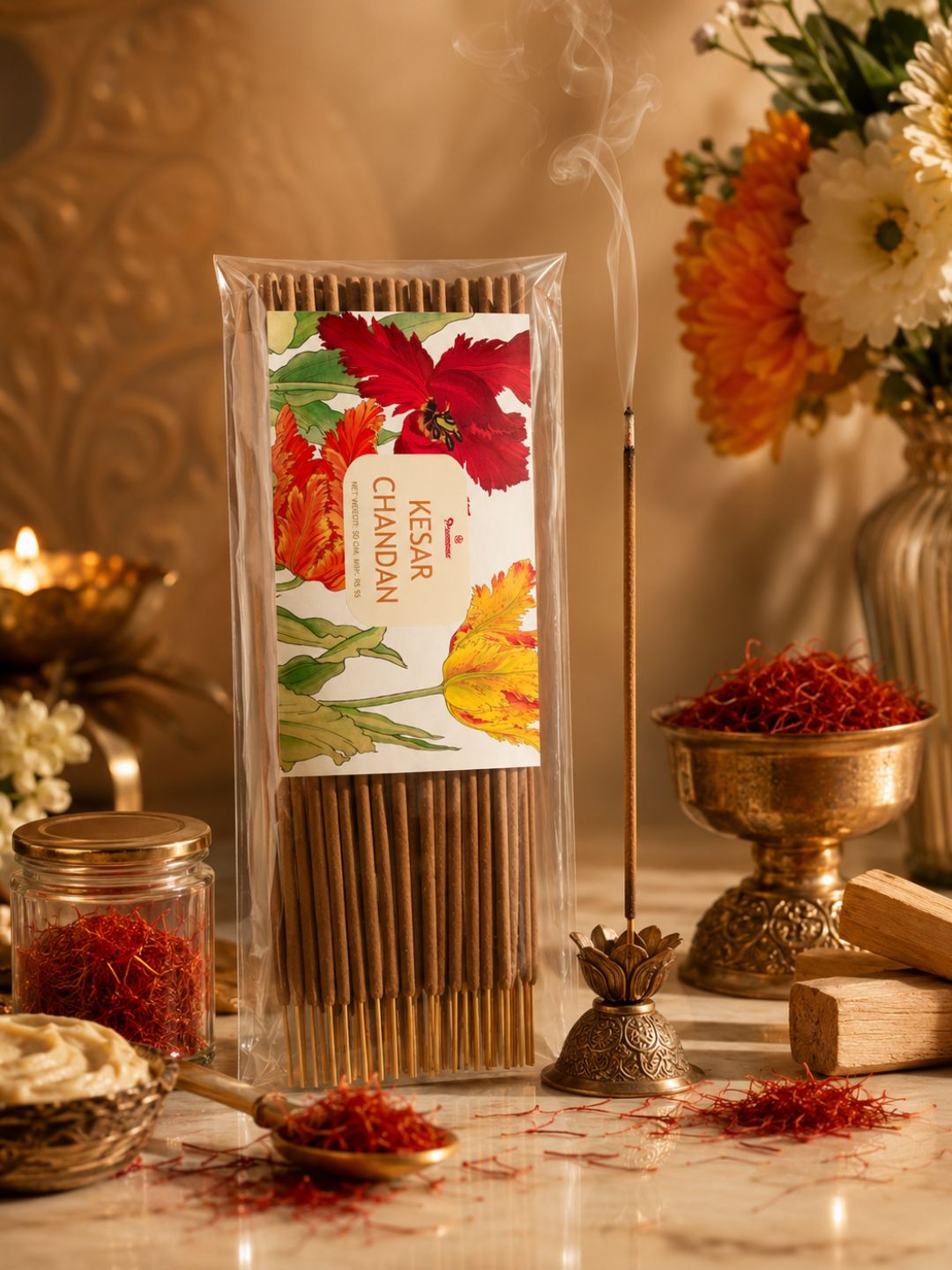 Premsons incense sticks pack with floral label beside brass incense holder and small flames