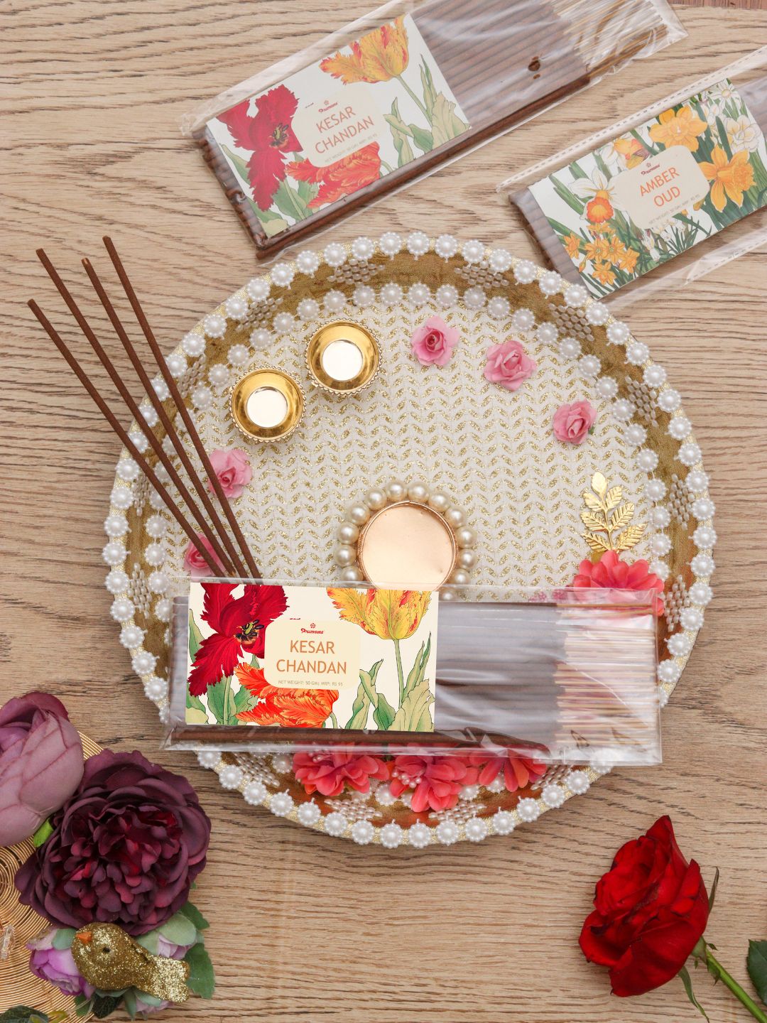 Premsons incense sticks pack with floral label on a pearl-trim decorative circle tray