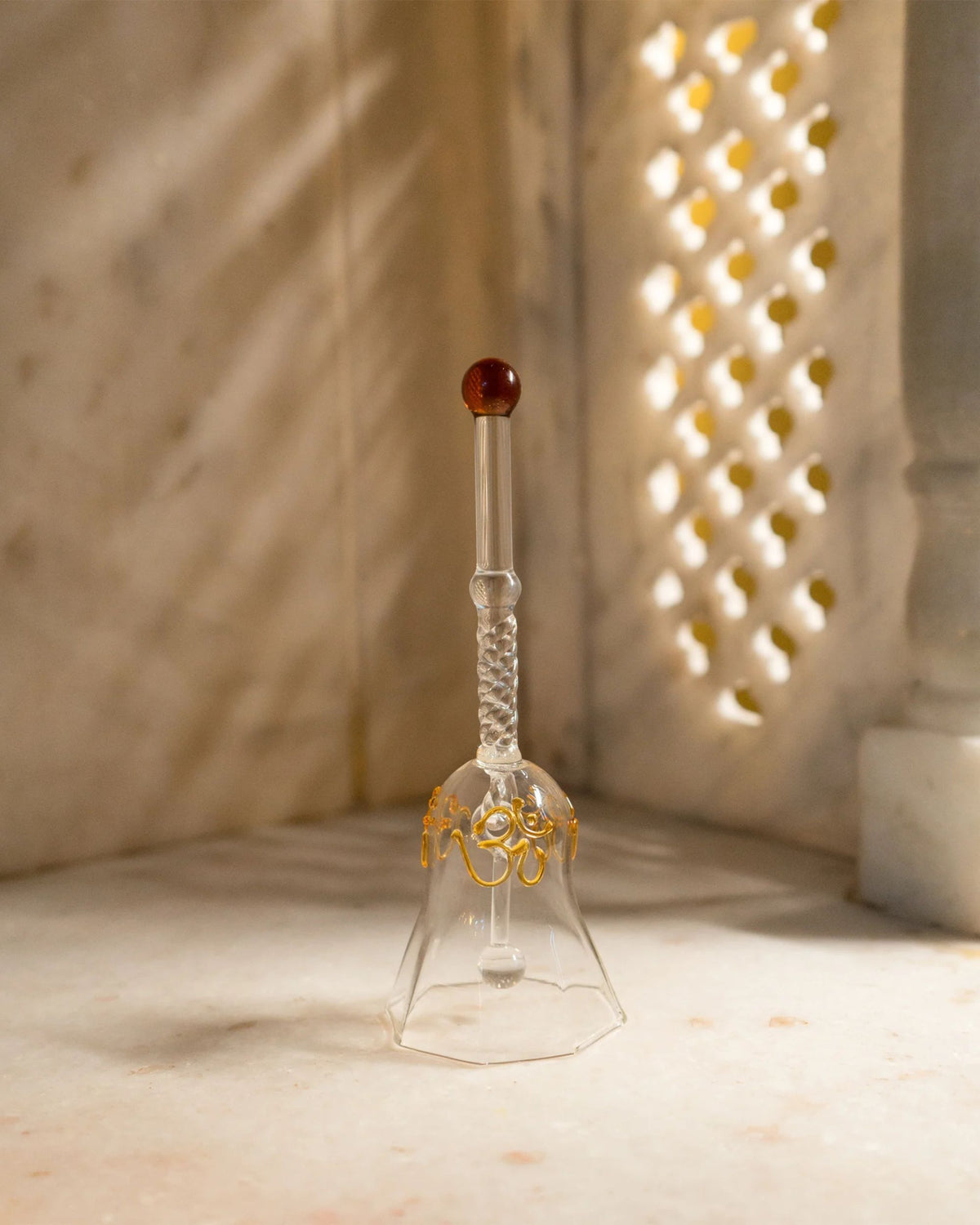 Crystal clear glass puja diya holder with engraved stem and small red top