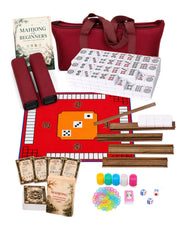 Mahjong beginner kit with red carry bag, white tiles, wooden racks, dice, and cards