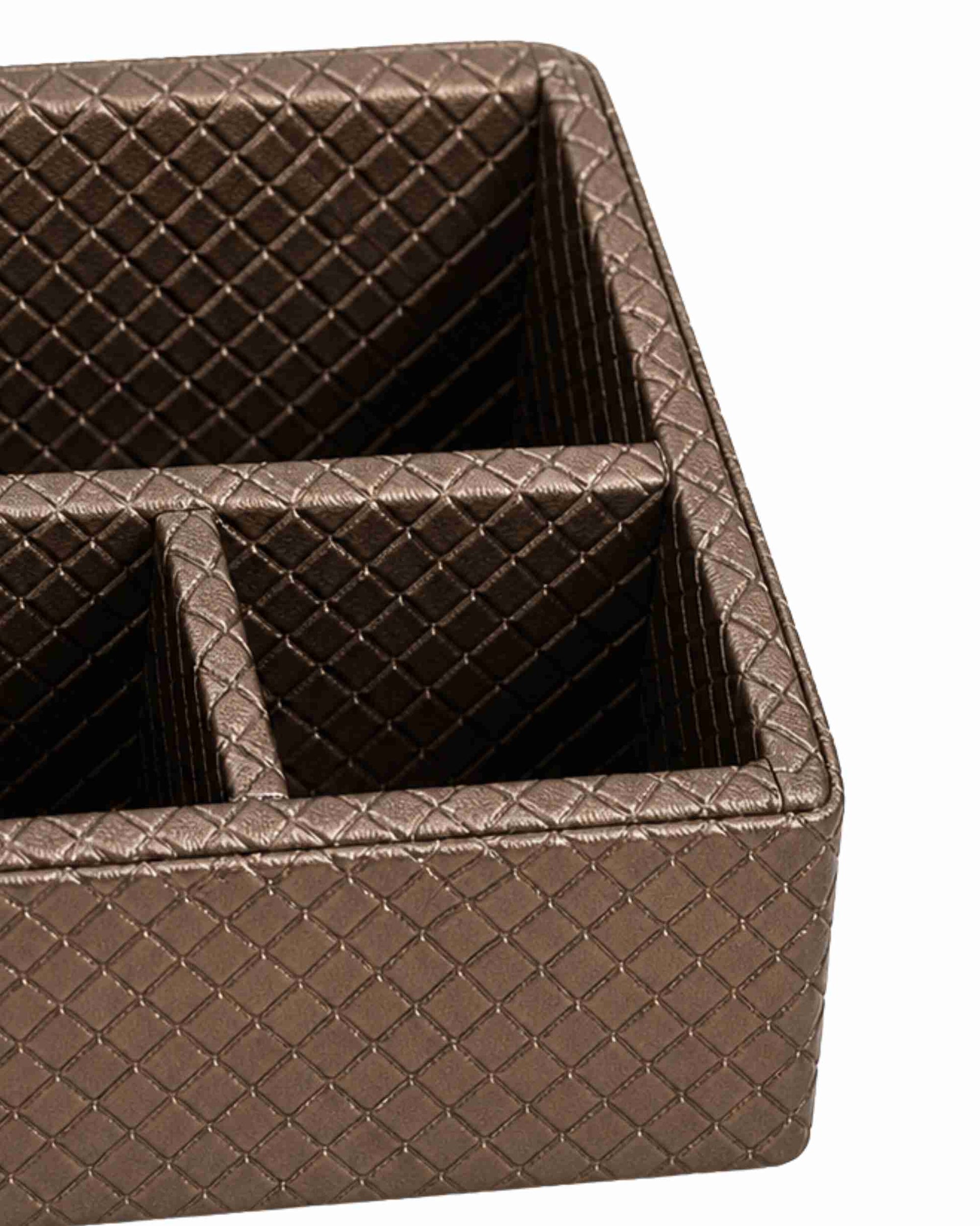 Three-compartment remote holder close-up: textured metallic brown open top with divider
