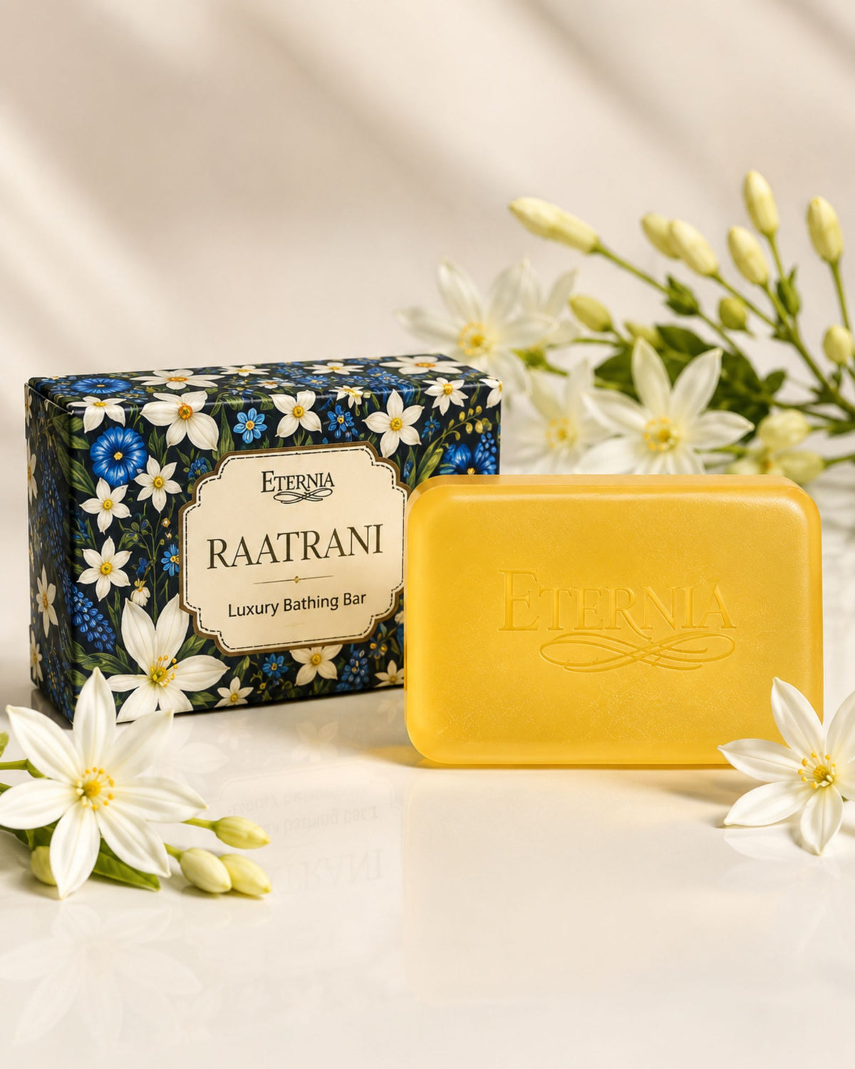 Eternia® Raatrani bathing bar with blue floral gift box and white flowers