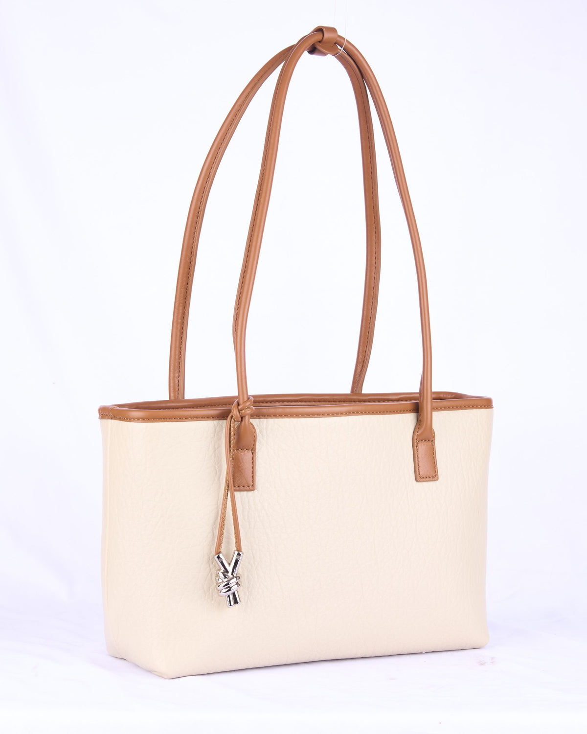 Cream tote-style women's handbag with tan leather trim, top drawstring, dual handles