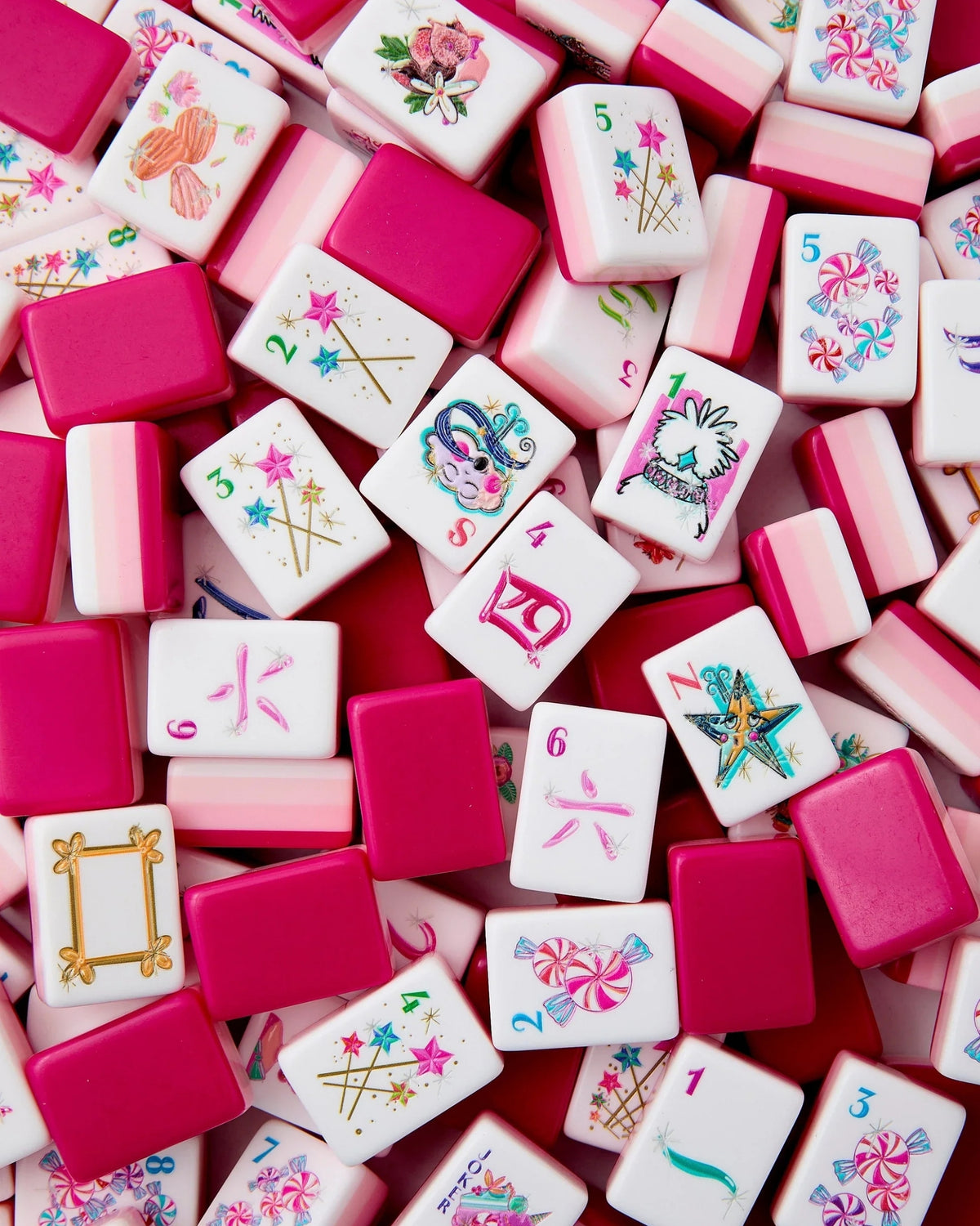 Assorted mahjong tiles: white faces with magenta borders and colorful motifs
