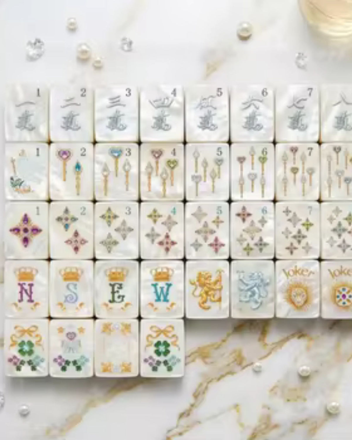 Pearlescent mahjong tile set with numbered and decorated tiles in a neat grid