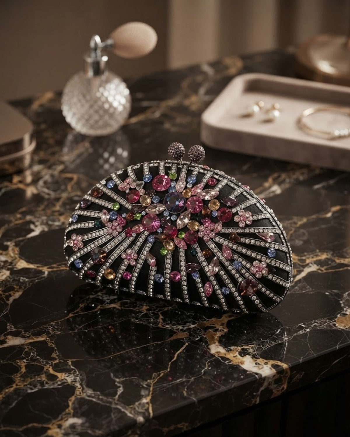 Black rhinestone evening clutch with gemstone floral burst, silver striped detailing