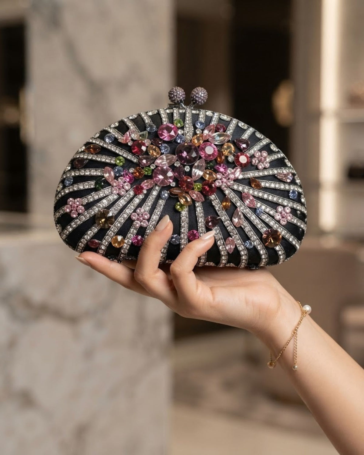 Black crystal embellished clutch with multicolour rhinestone burst design and twin clasp