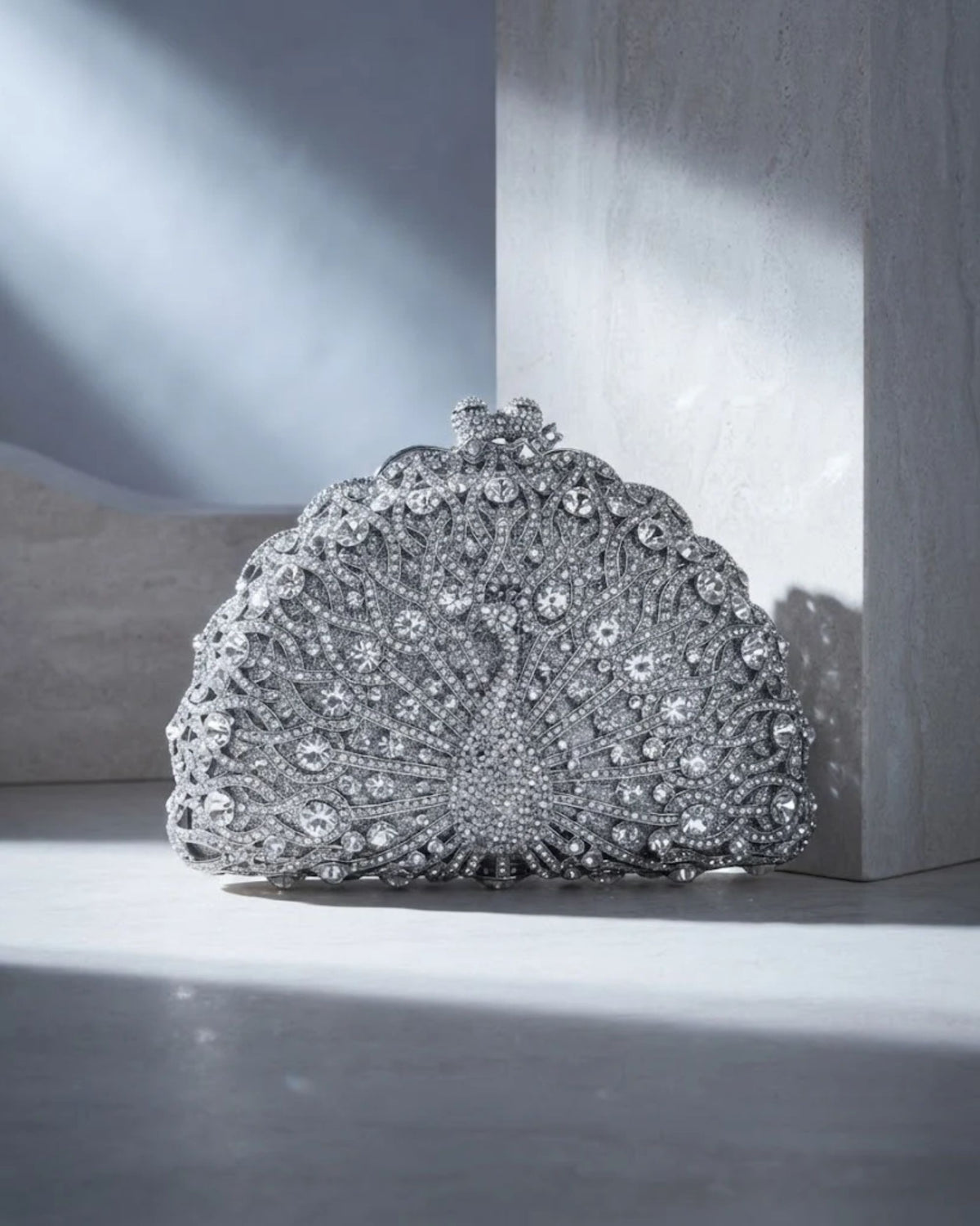 Silver rhinestone crystal clutch bag with fan-style embellished front and round top clasp