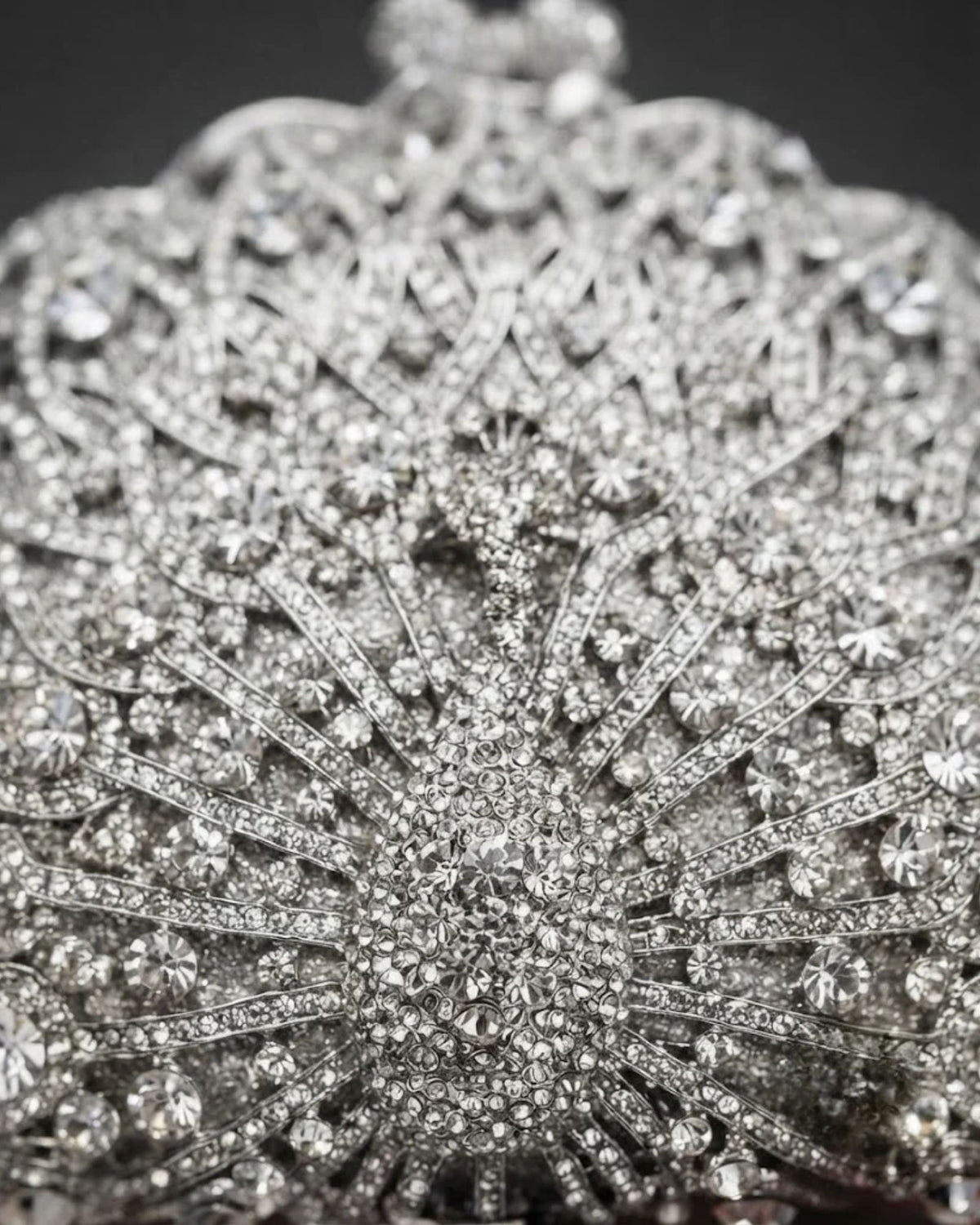 Silver rhinestone fan design clutch front close-up with sparkling crystal details