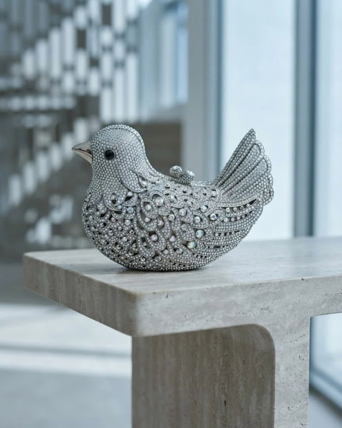 Silver rhinestone bird-shaped evening clutch with sparkling crystal pattern and raised tail