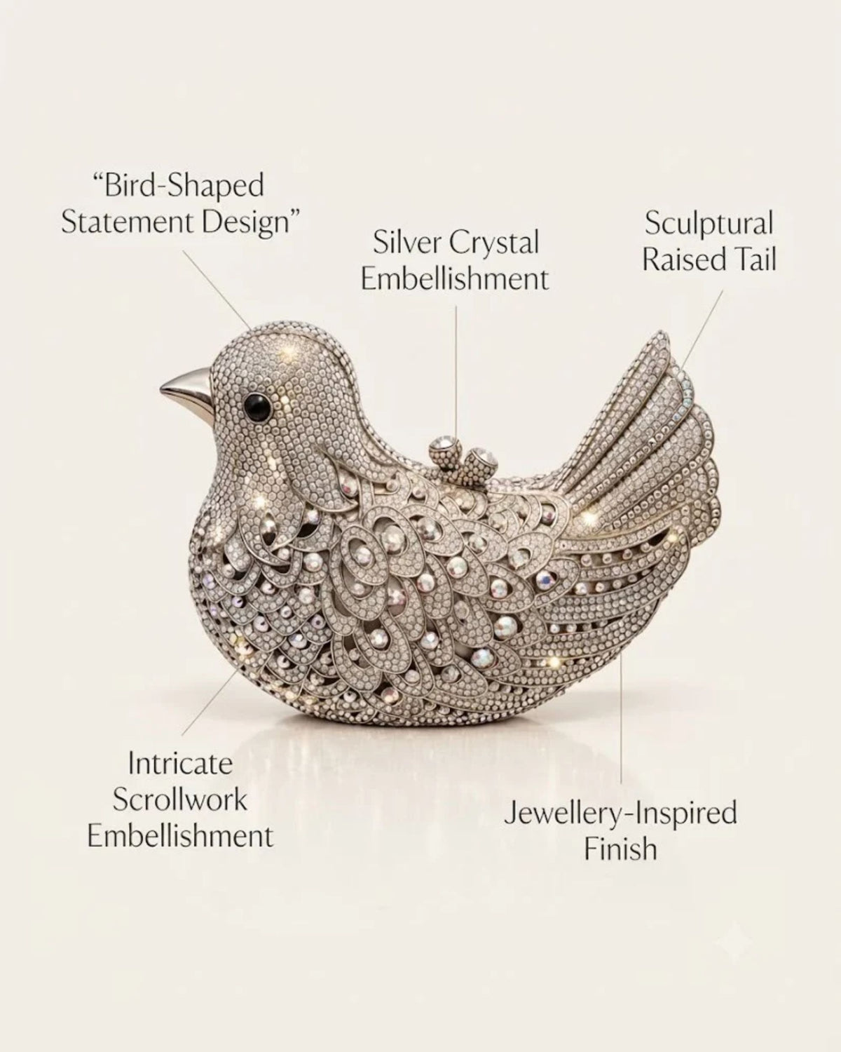 Silver crystal bird-shaped clutch with intricate embellishment and raised tail