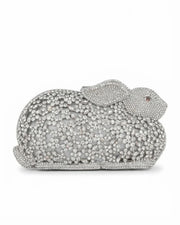 Silver crystal rabbit-shaped clutch with sparkling rhinestone texture and rounded shell shape