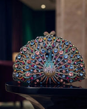 Peacock crystal clutch with multicolour rhinestone fan design and round clasp