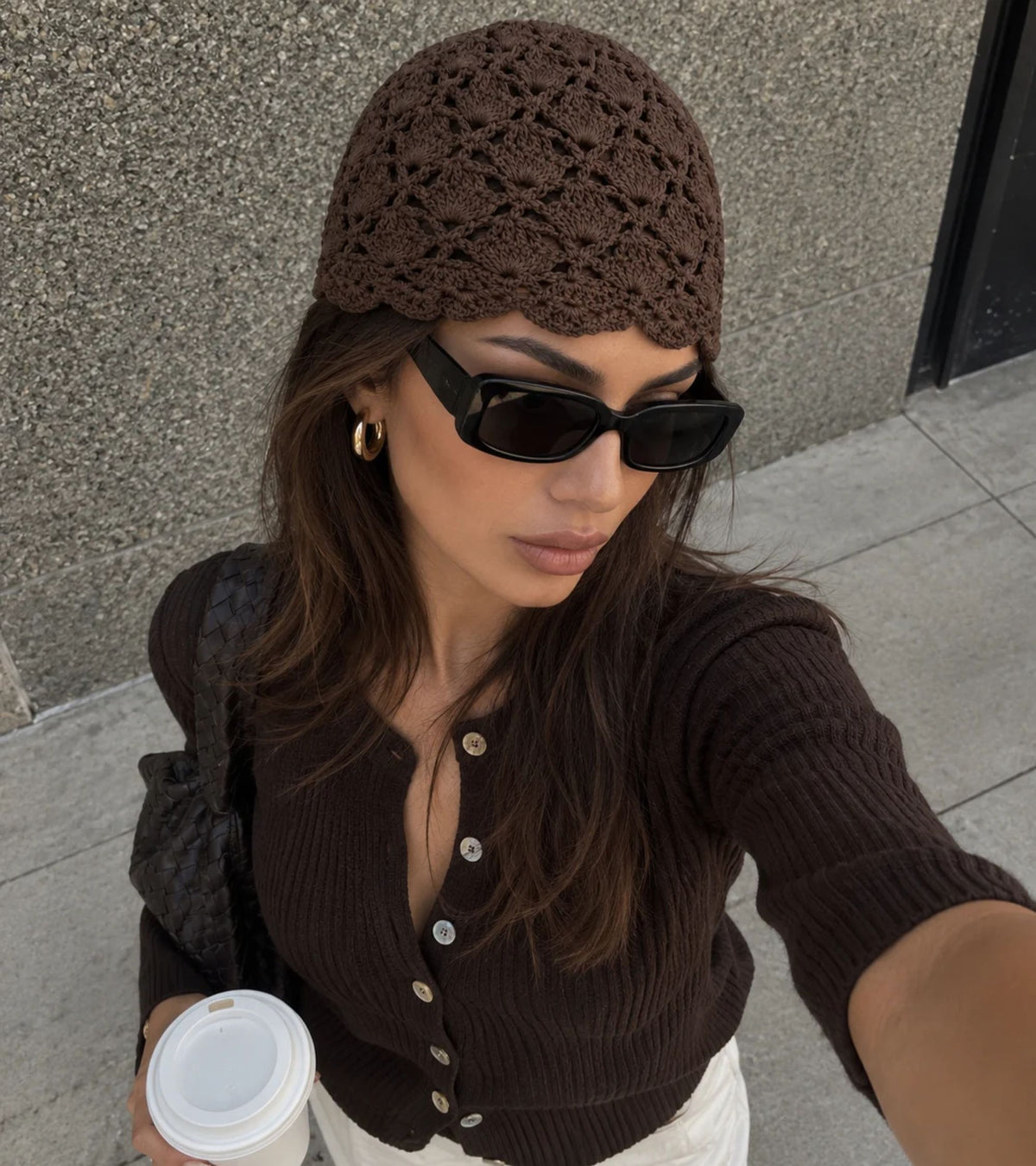 Dark brown openwork crochet beanie hat with scalloped lace pattern