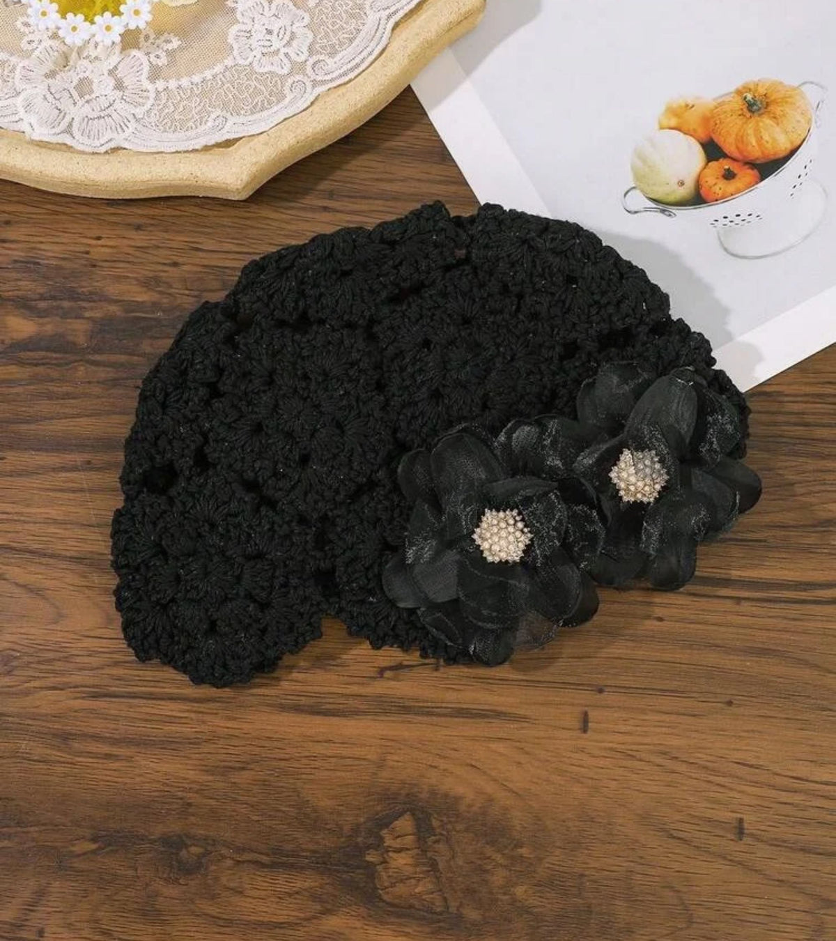 Black crochet beanie with organza flower applique and pearl button detail