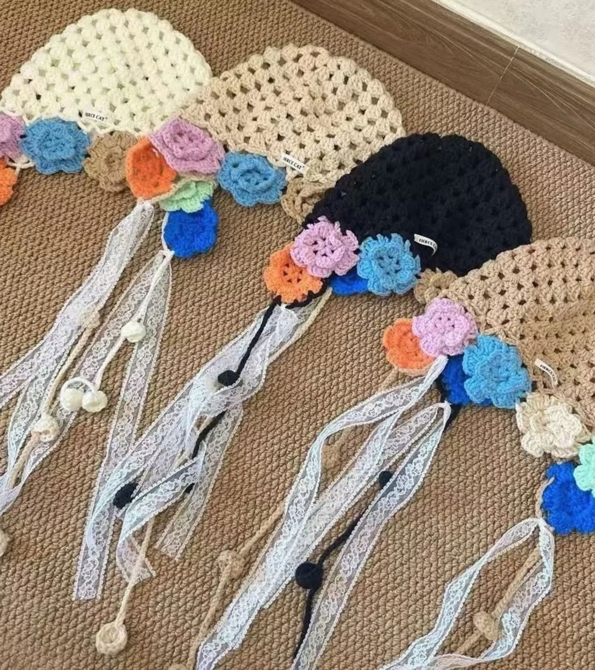 Crochet bonnet in light tan with multicolor 3D flower garland and lace ribbon ties