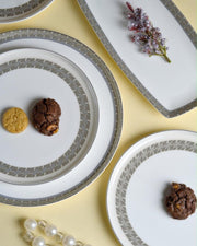 Premsons® white ceramic plates and rectangular platter with champagne gold geometric borders