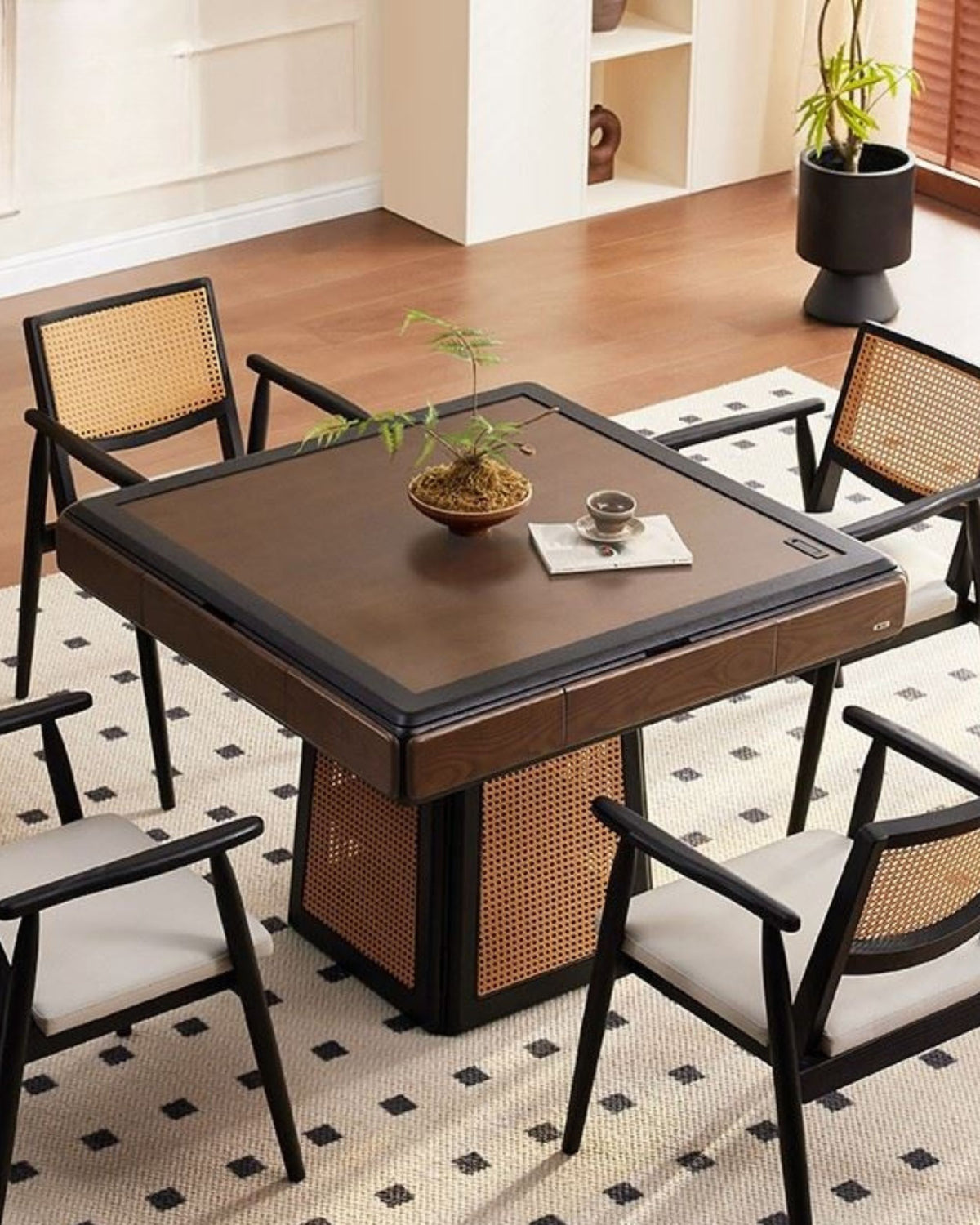 Mahjong table with four chairs and woven wicker panels, set with tiles on top