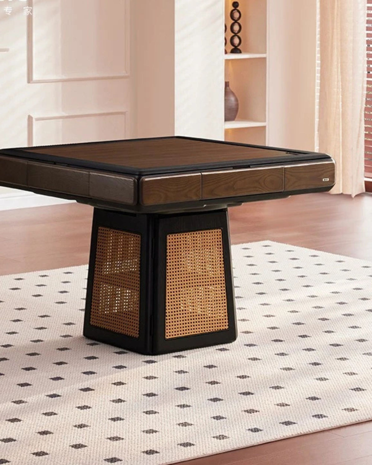 Mahjong table centered on patterned rug, dark tabletop with woven wicker side panels