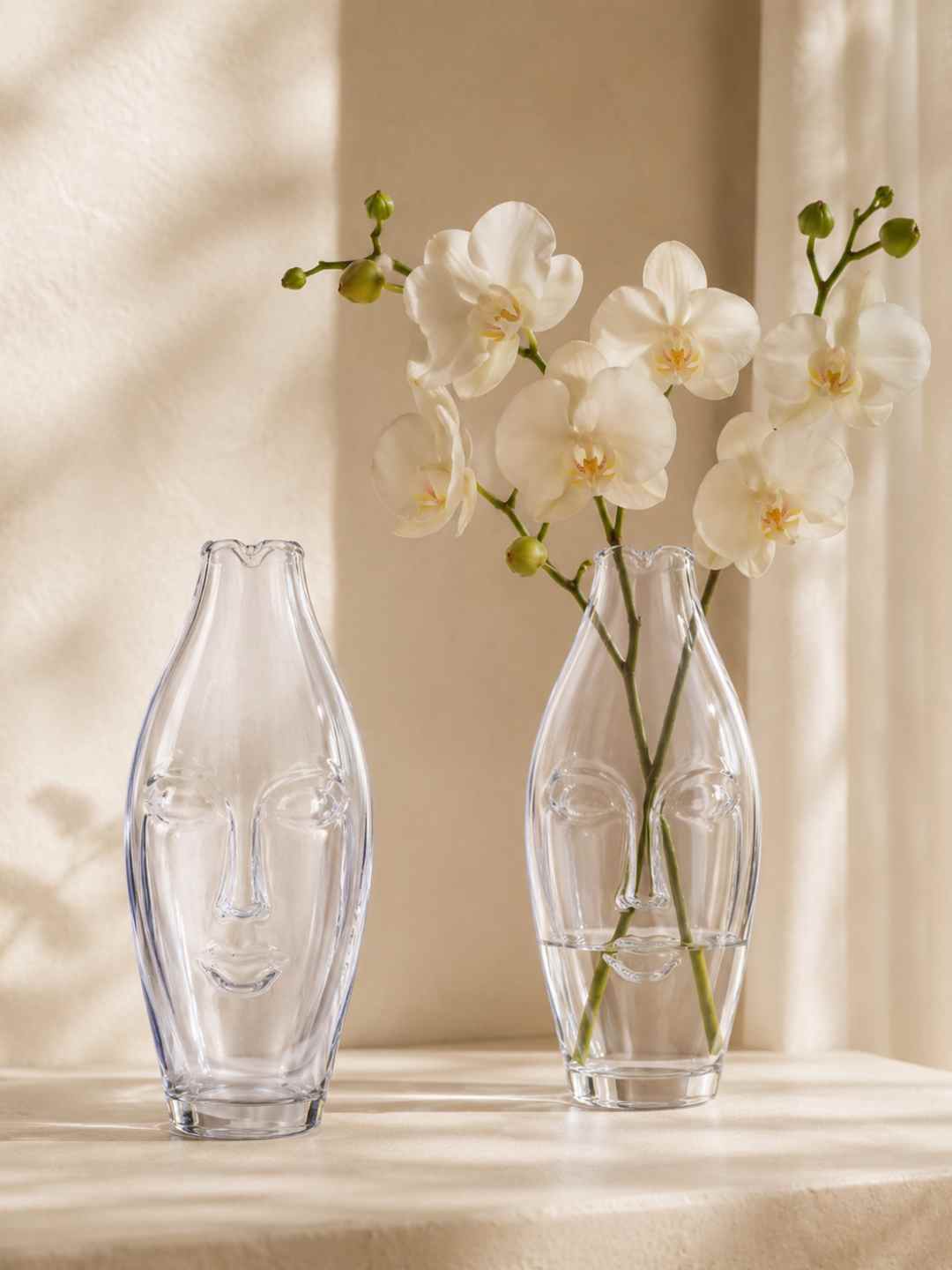 Clear glass face vase, tall tapered abstract shape with sculpted face details