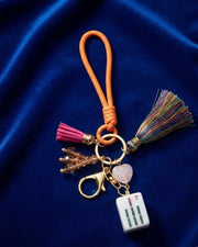 Premsons mahjong keychain with orange loop, multicolor tassels, and small charm set