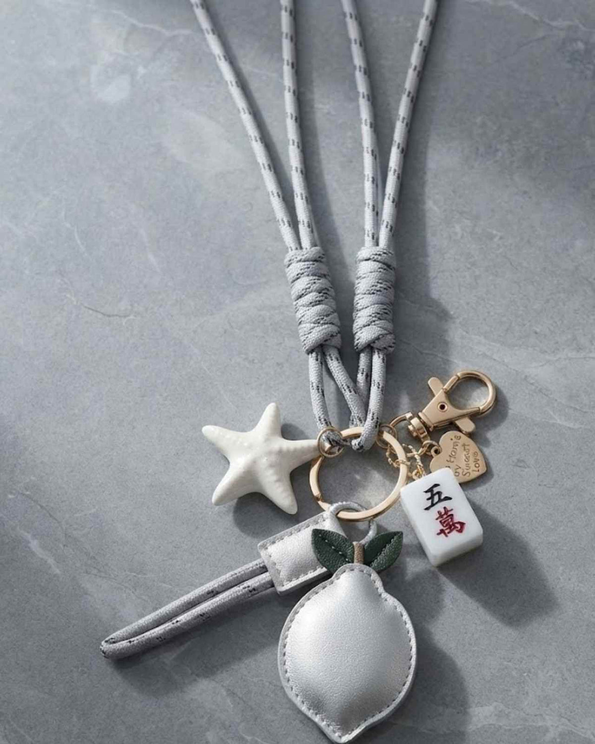 White star mahjong keychain with heart pouch and small gold-tone ring attachments