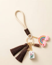Premsons® mahjong keychain with rainbow charm, tassels, and small tile pendant