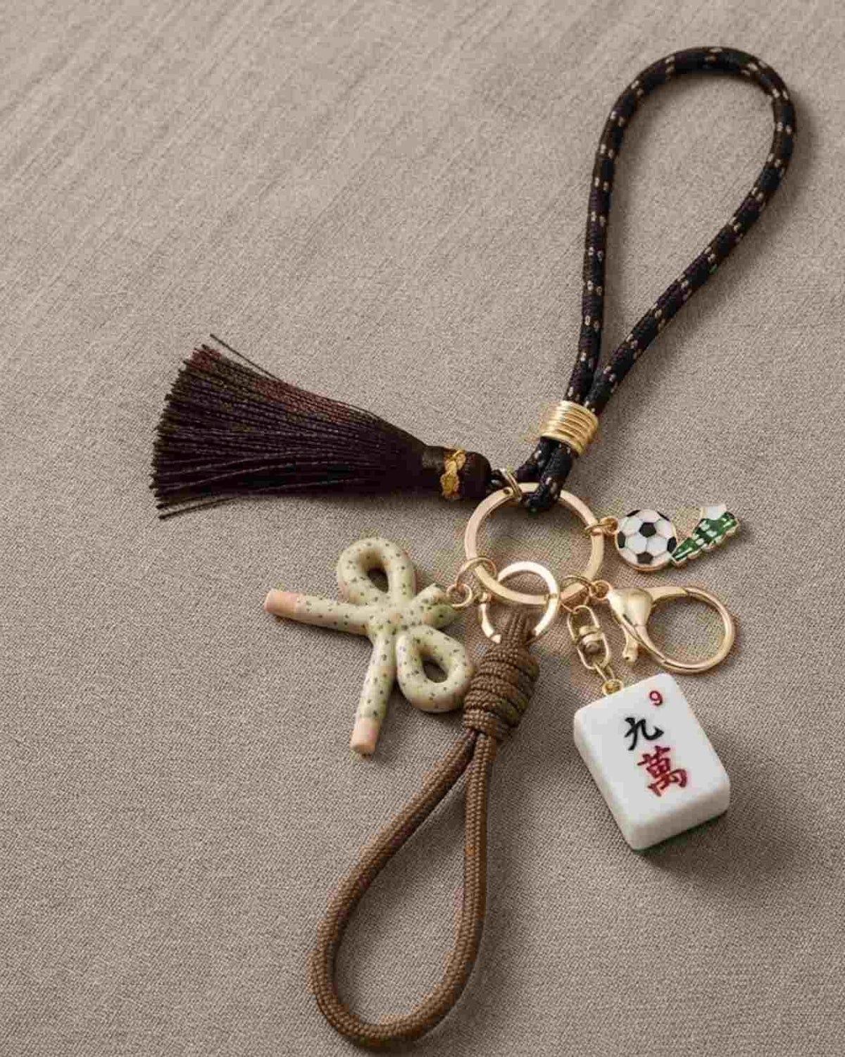 Mahjong keychain with brown tassel, beige tile charm, starfish and coin charms, key ring