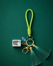 Premsons® green mahjong keychain with white charm, gold keyring, and green tassel cord