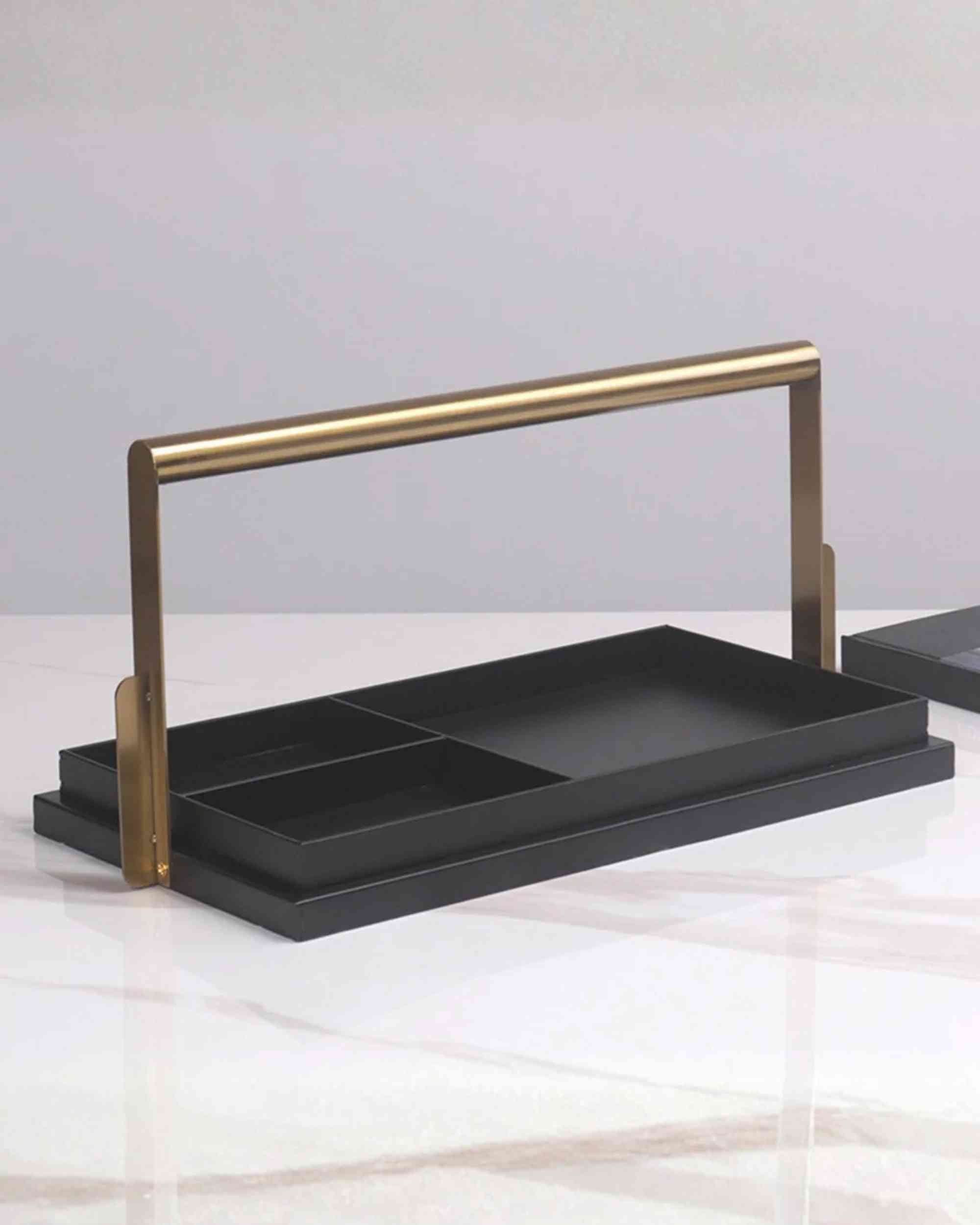 Black metal desk tray with two compartments and gold-tone support frame