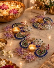Premsons® peacock tealight holder with colorful jeweled feather motifs and a lit candle