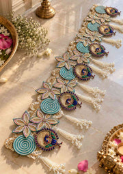 Peacock decorative toran banner with teal and gold motifs and pearl tassels for door decor
