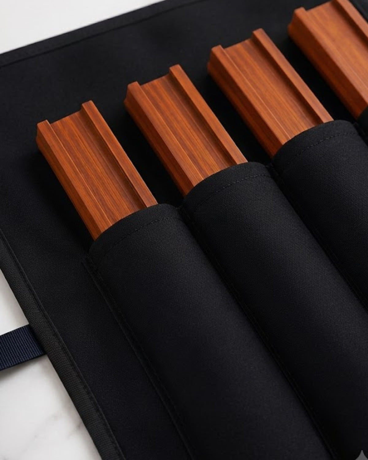 Black mahjong rack cover with individual wooden-slot dividers and rolled tube end.