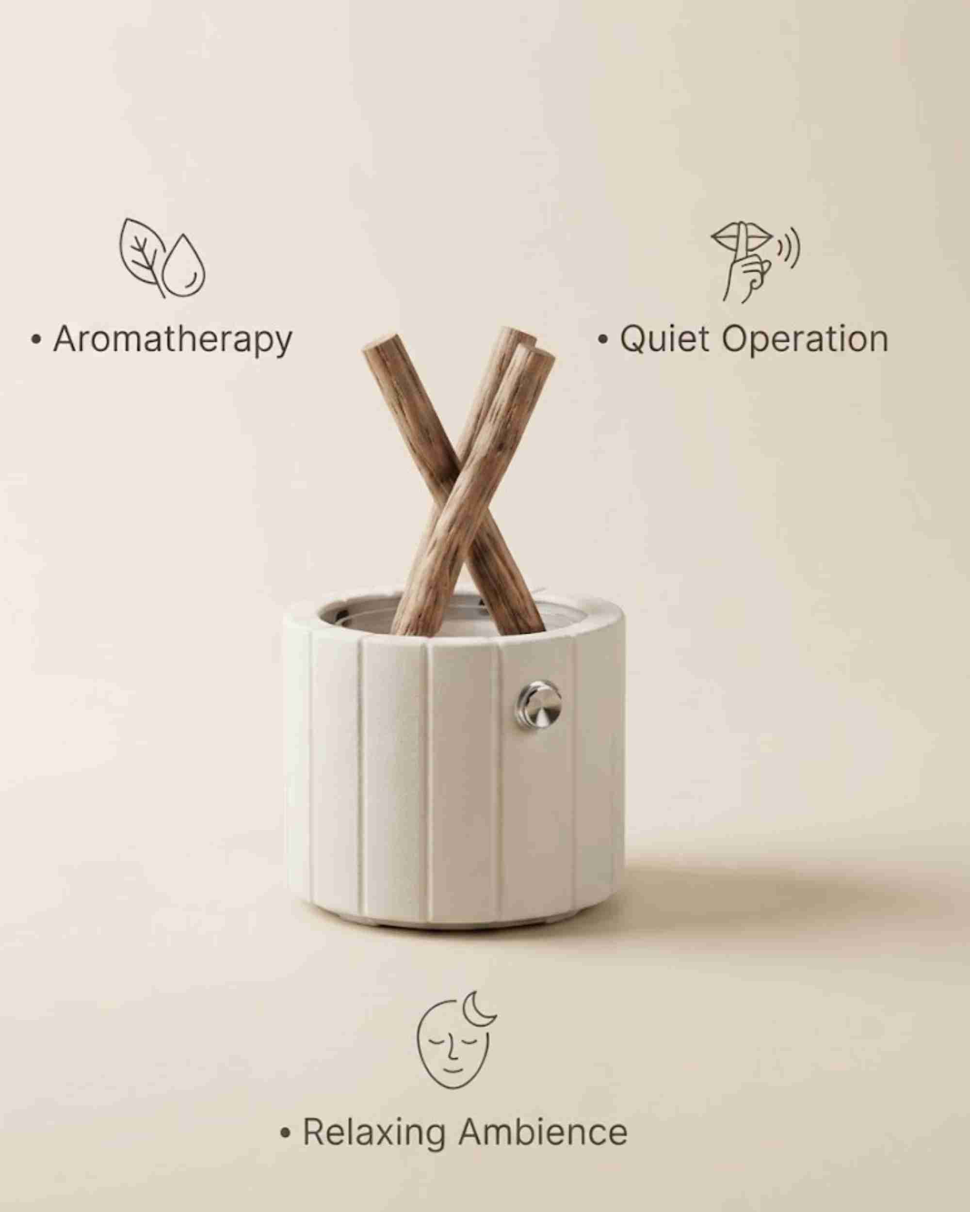 White ceramic aroma diffuser with stacked wooden logs and side control knob