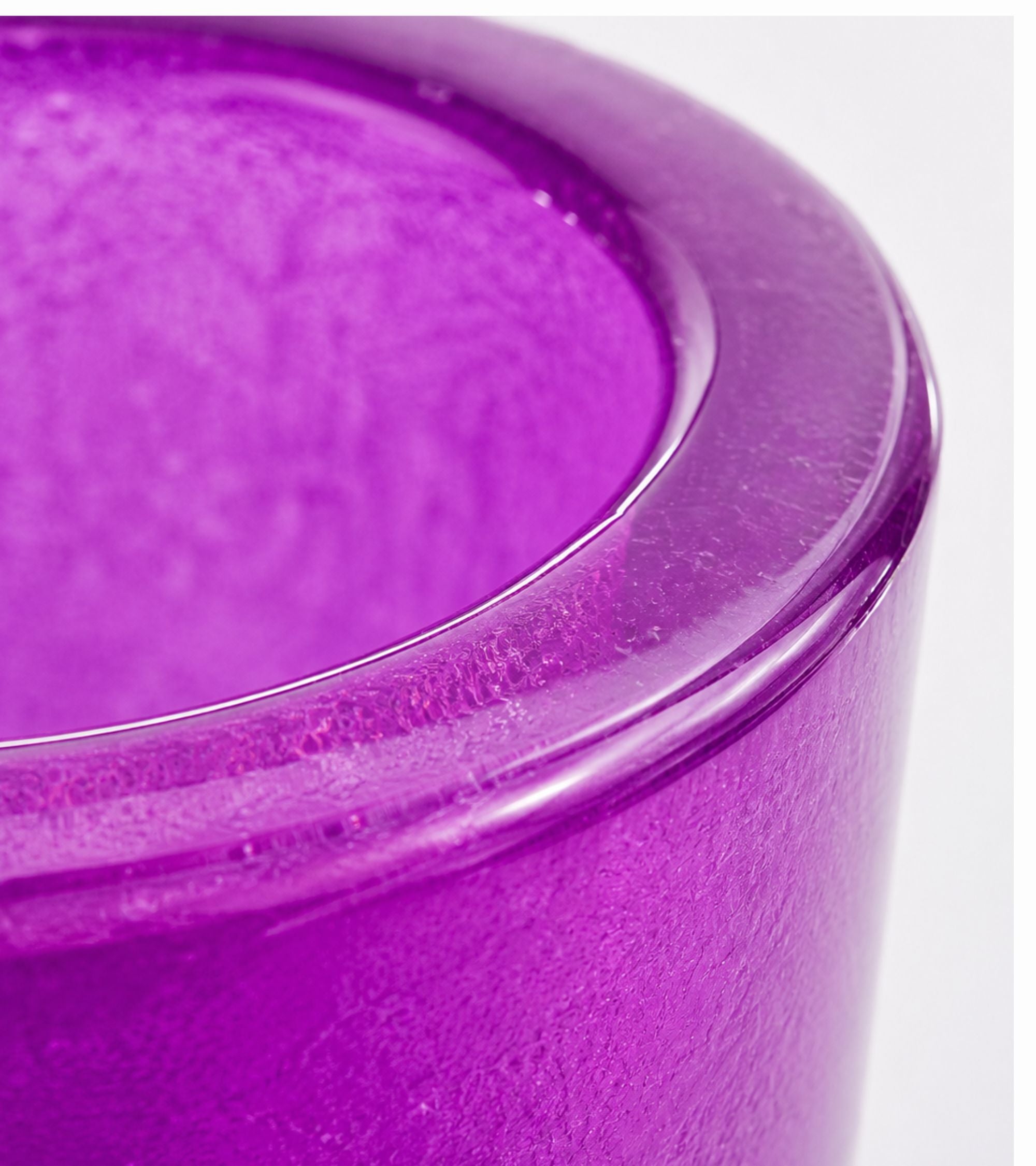 Purple glass votive candle holder with round lip