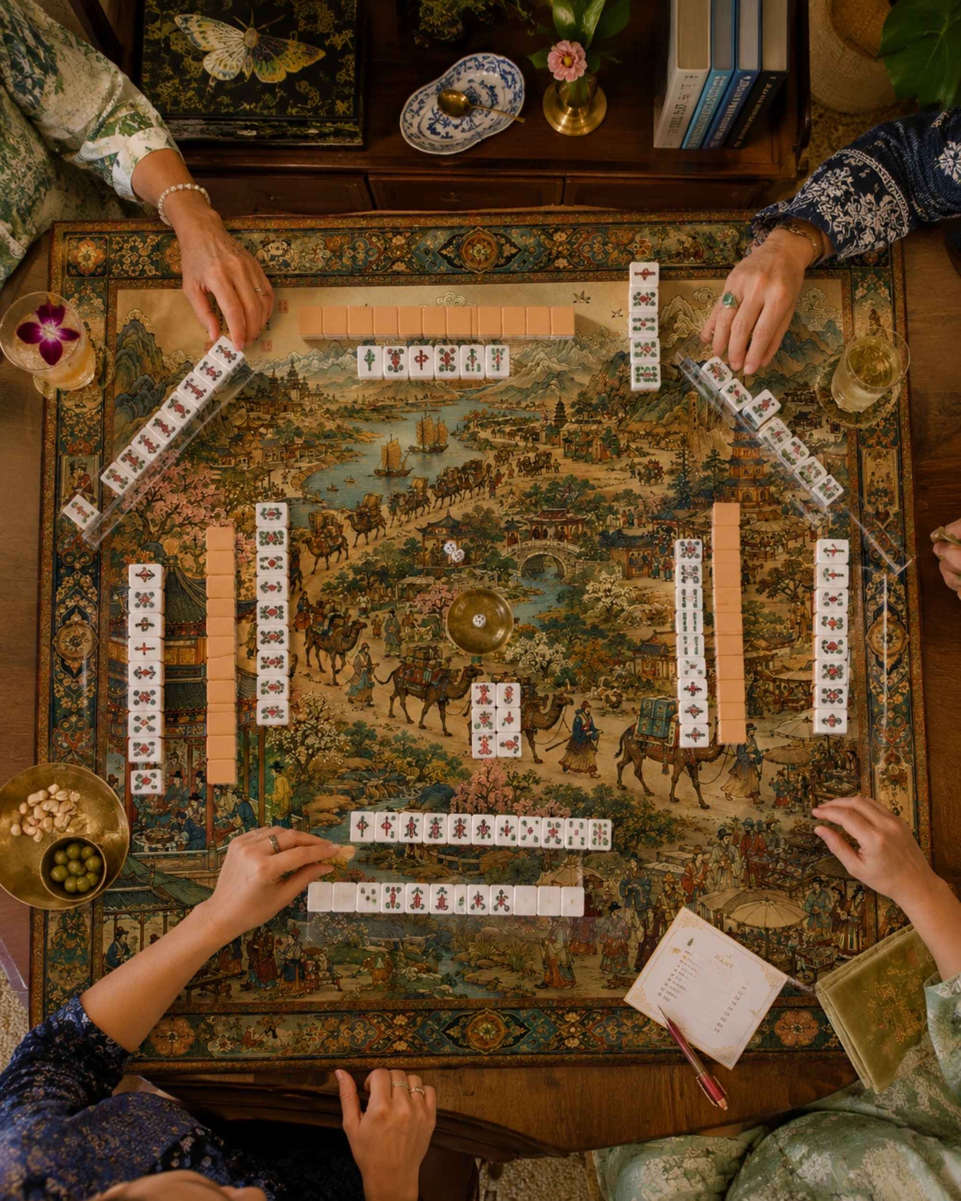 Square decorative table mat with detailed landscape artwork and edge tile rails