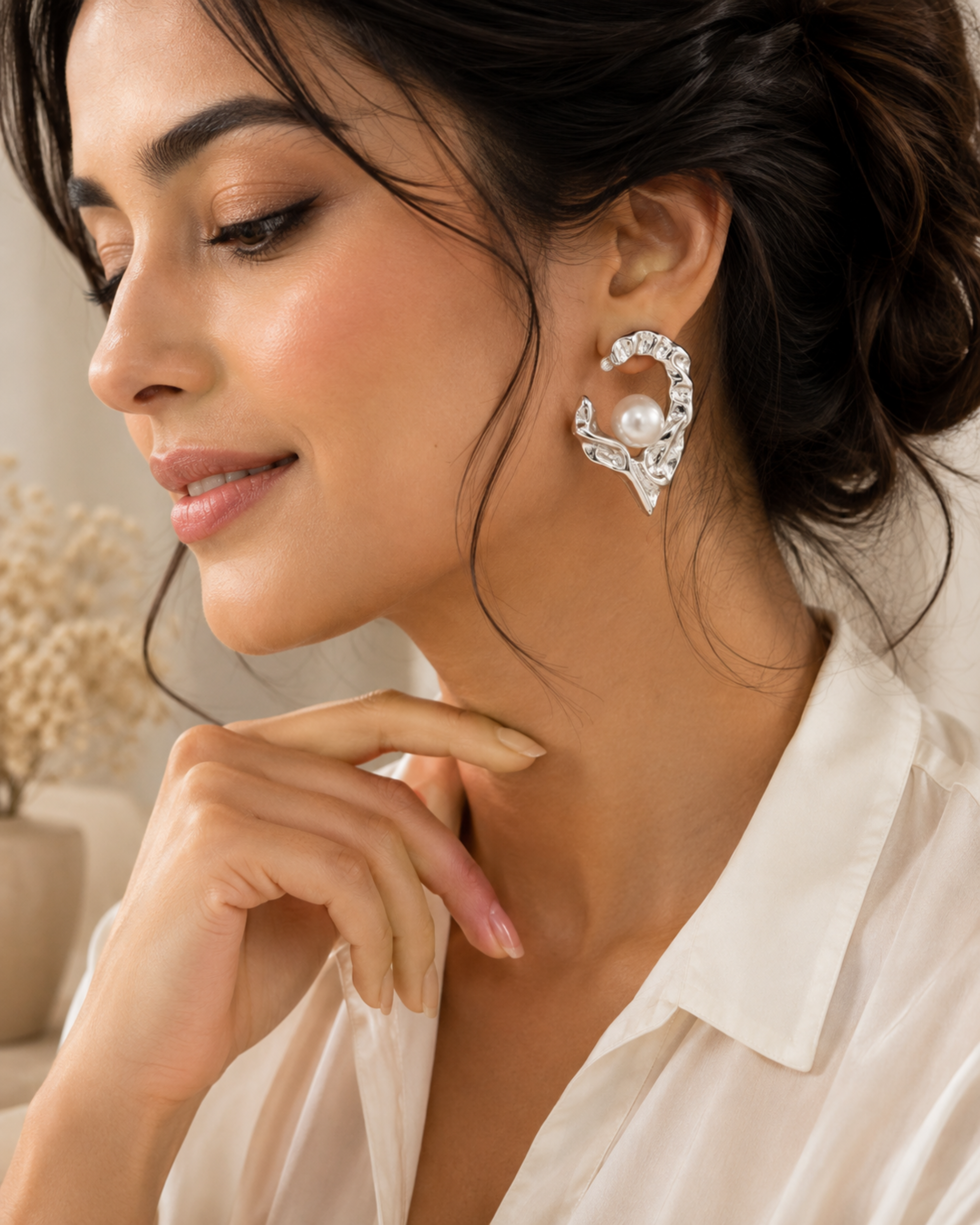 Silver heart pearl stud earrings on model, round white pearl with crystal rim