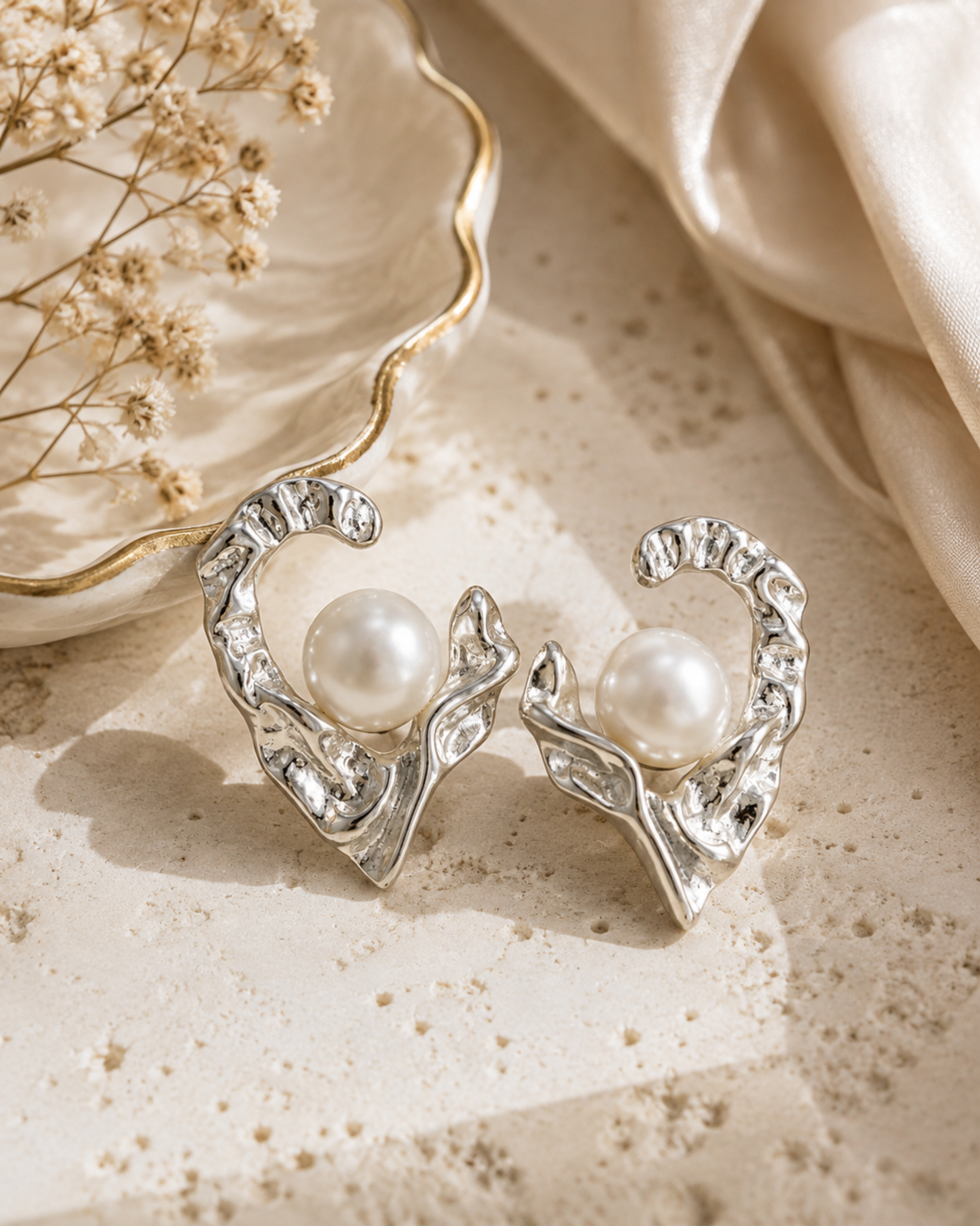 Silver heart pearl stud earrings, clear crystal edges around a white round pearl
