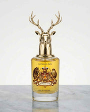 Oud eau de parfum bottle with deer-head gold cap, amber glass, Supreme Oud label