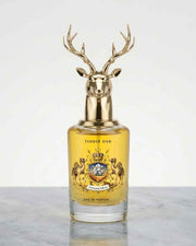 Eternia® Tender Oud eau de parfum bottle, gold deer antler cap, amber liquid