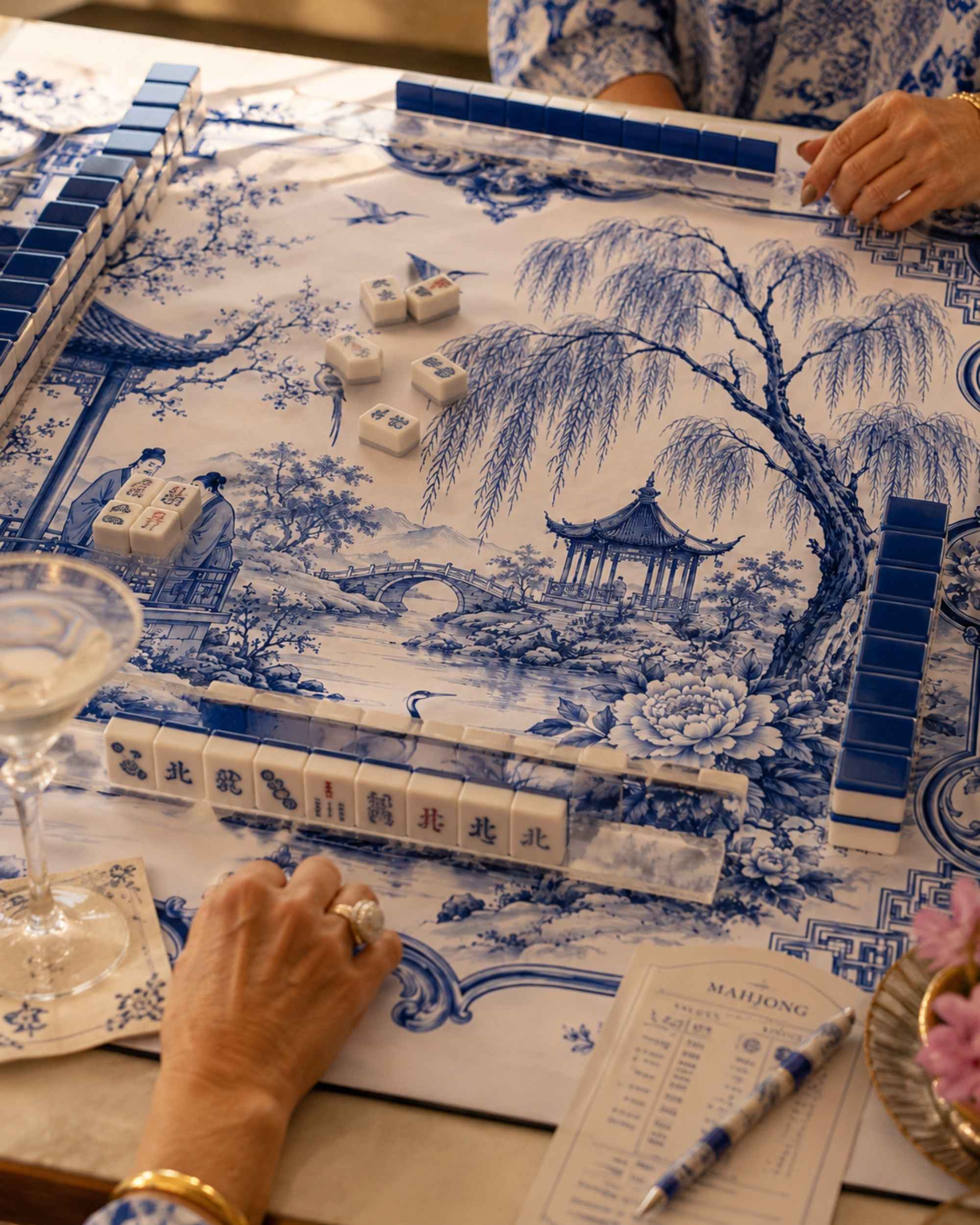 Close-up of square mahjong table mat with blue-and-white porcelain pattern surface