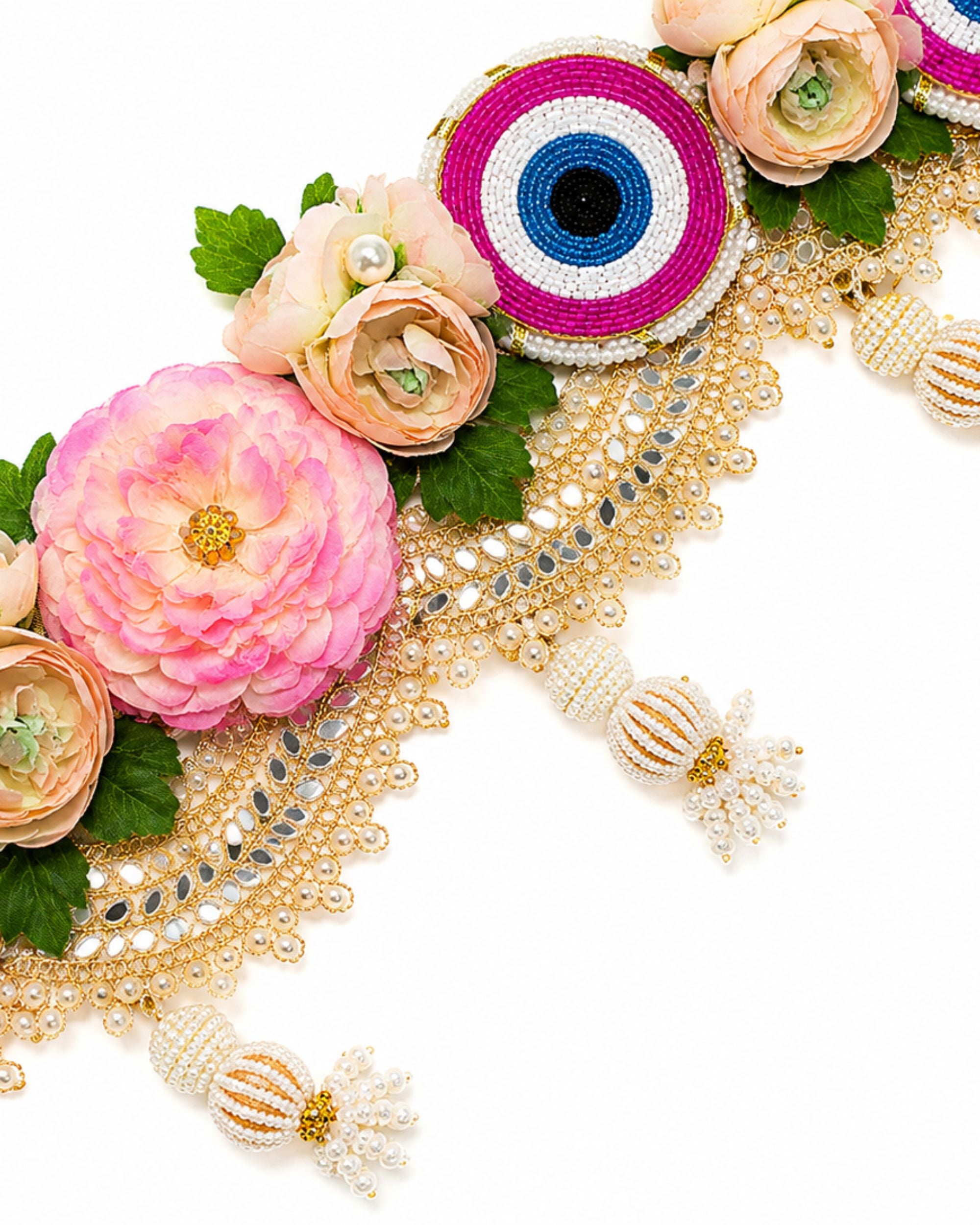 Floral toran door hanging with evil-eye beads, pink and cream flowers, decorative tassels
