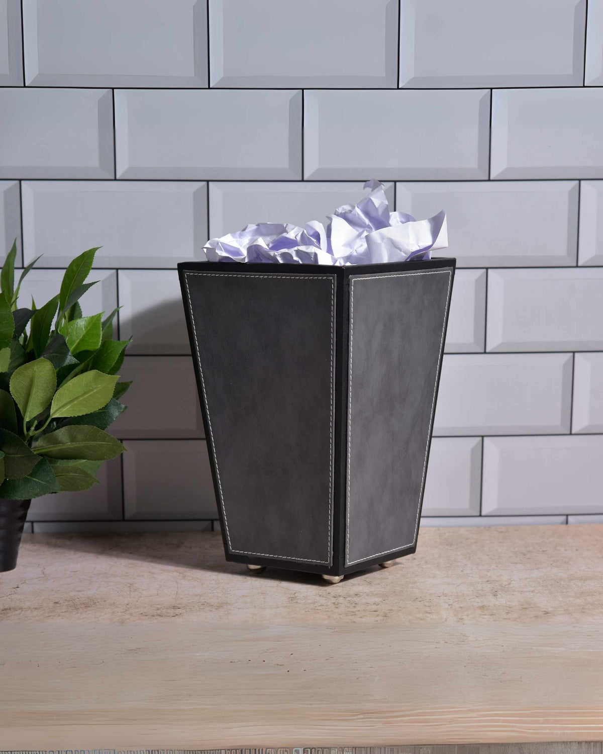 Two-tone faux leather cone waste bin with open top and metal base, charcoal grey