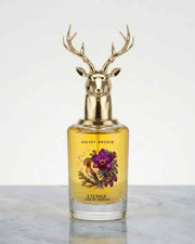 Eternia® Velvet Orchid eau de parfum bottle with gold deer-antler cap, amber liquid