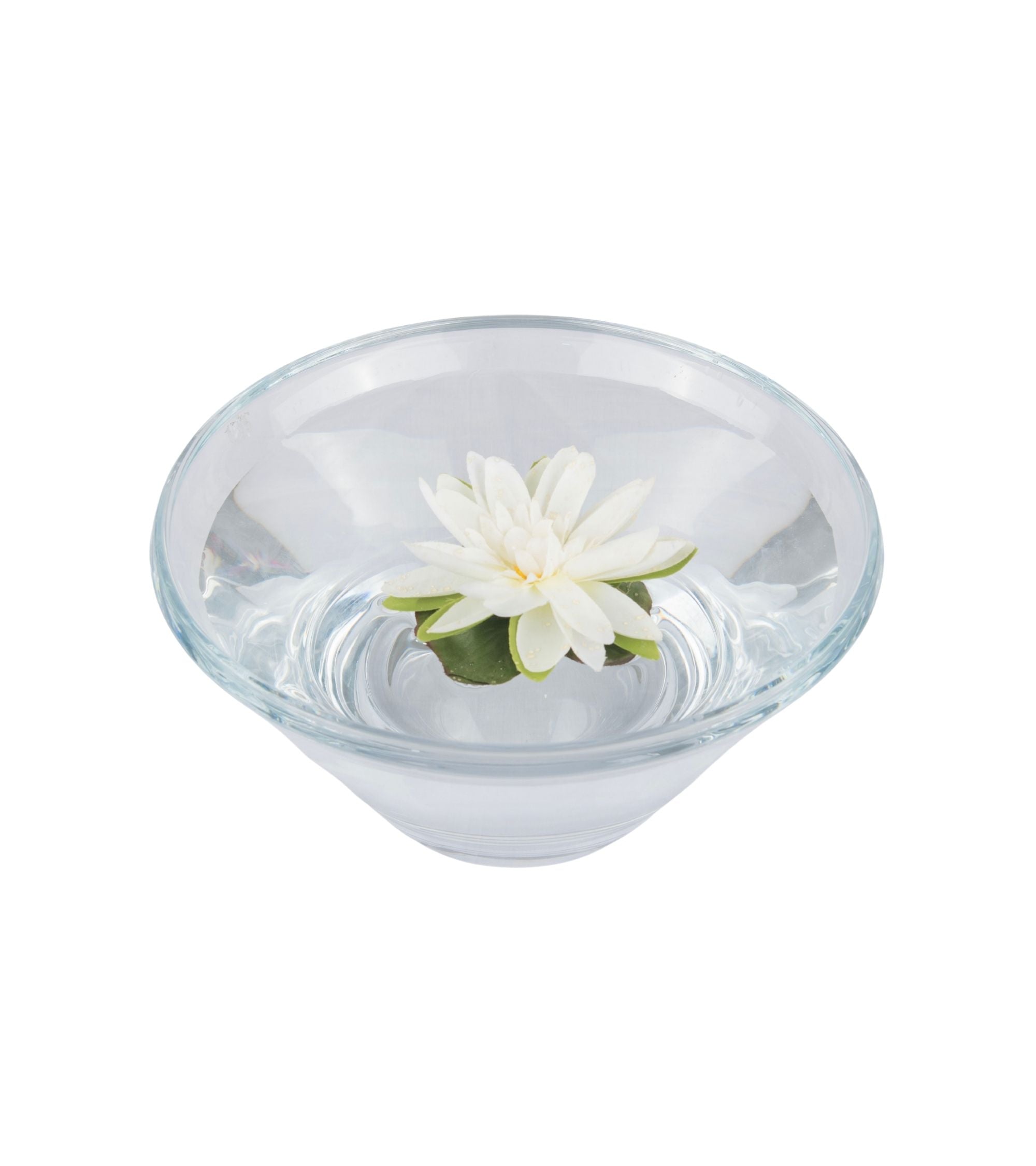 Transparent bowl with white lotus flower and green leaves, top view centerpiece