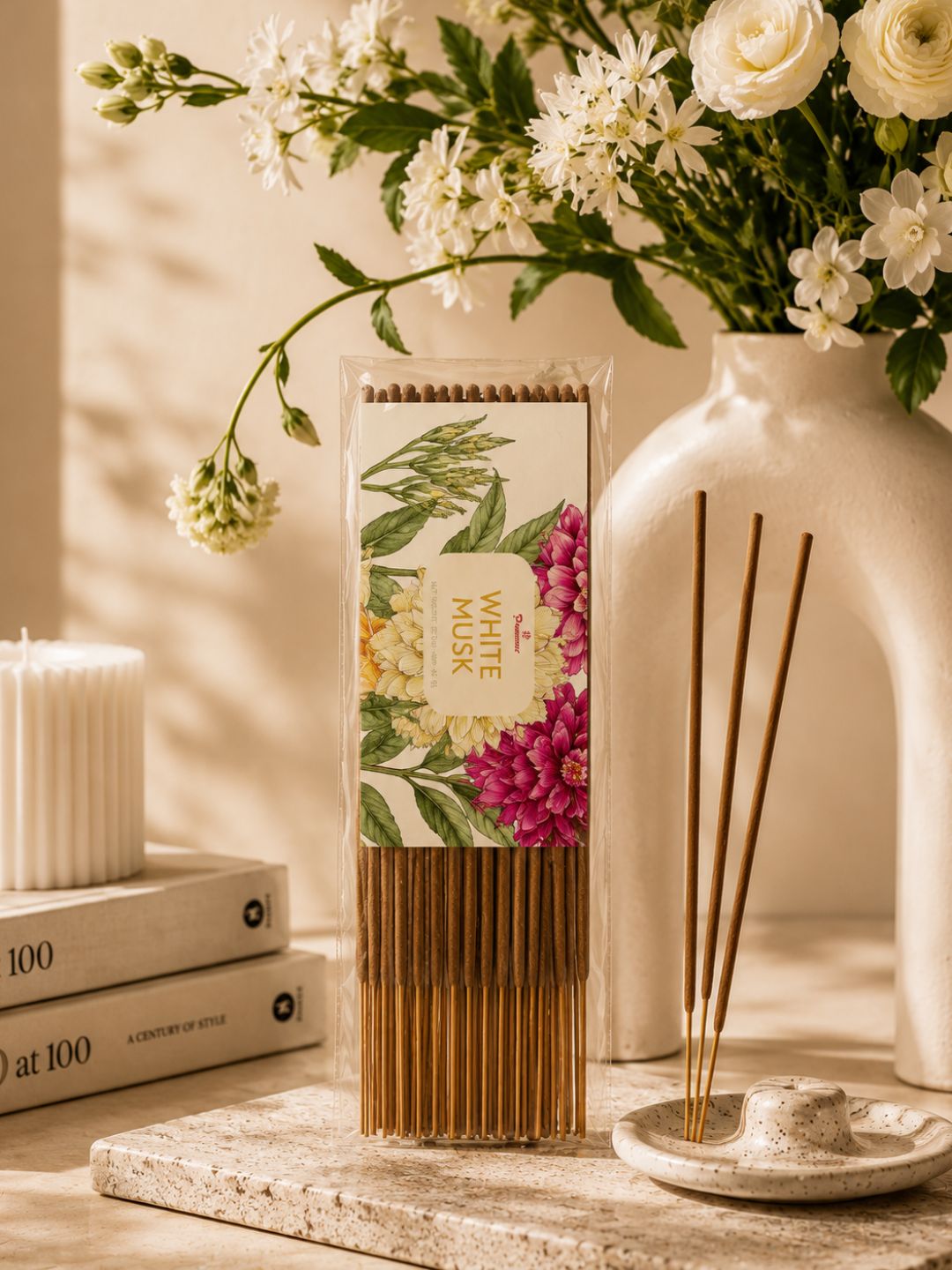 Agarbatti incense sticks pack with floral label and bundle of brown sticks