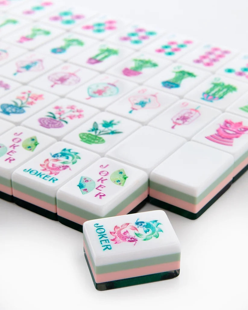 Stacked mahjong tiles with Joker tiles and floral pot symbols on white faces
